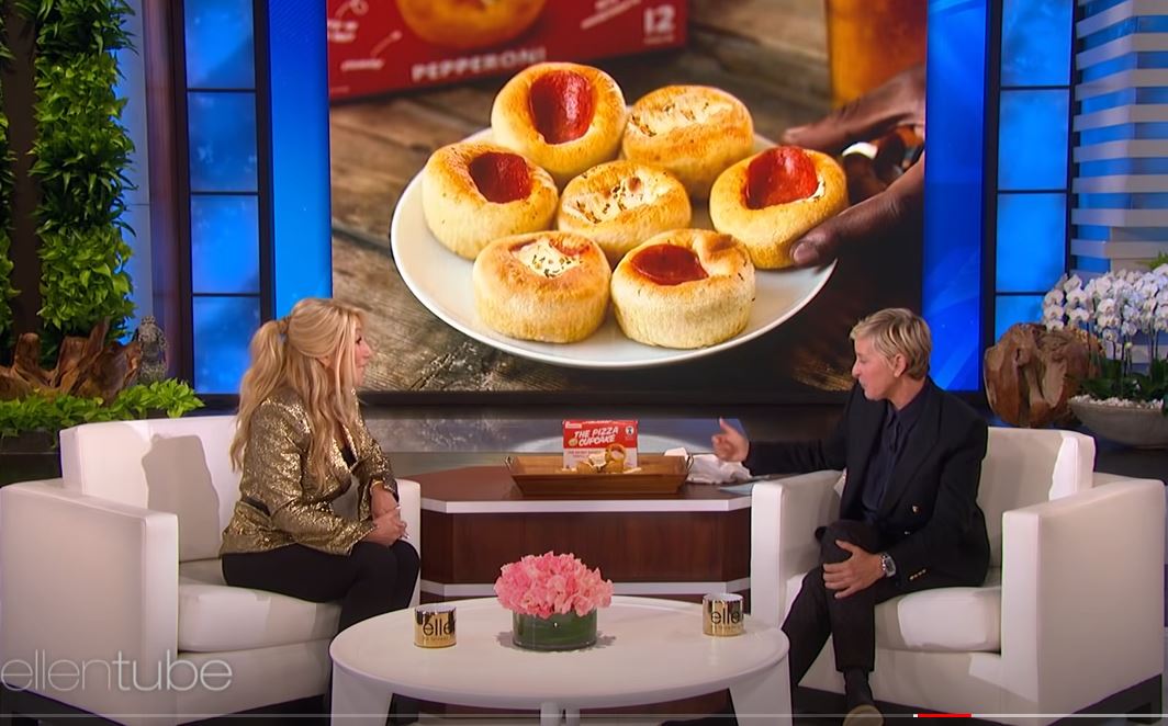 Two persons sitting on sofa and talking about Pizza Cup Cake