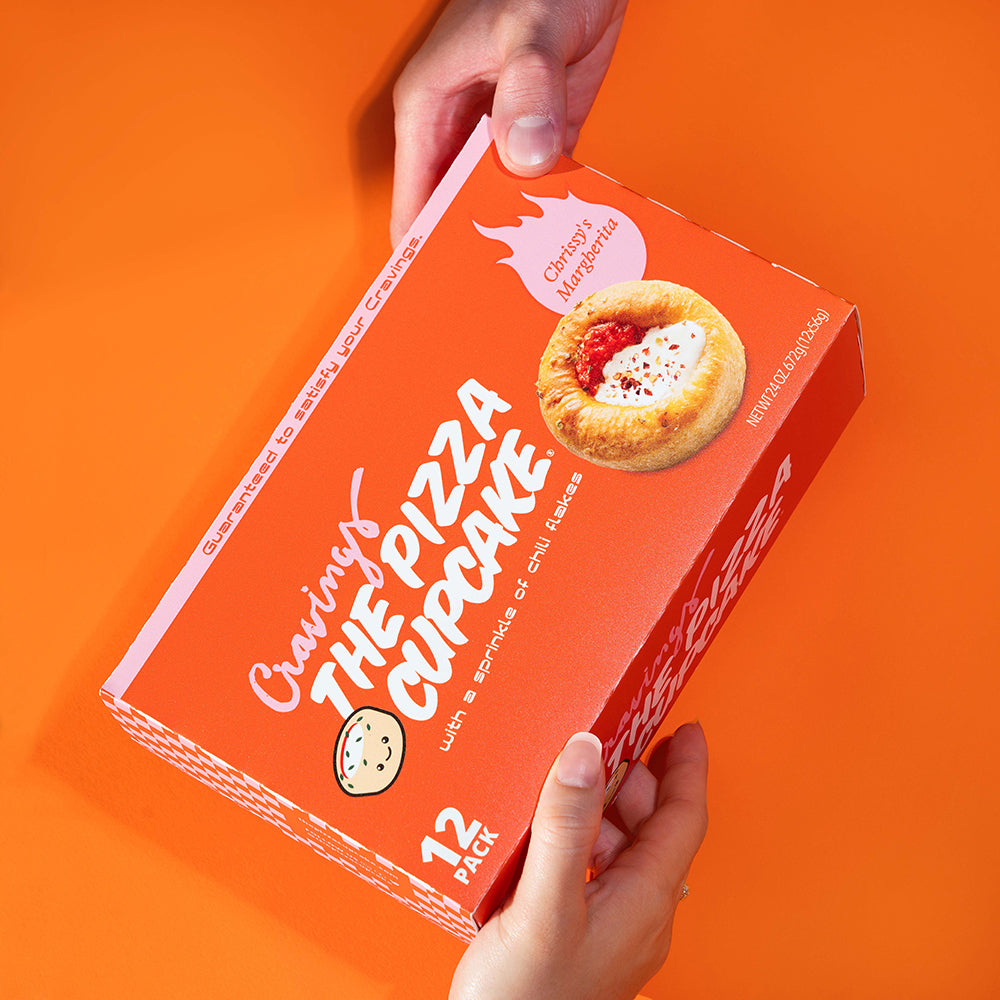 two person holding pack of 12 pizza cup cake